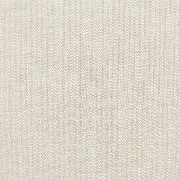Close-up of textured twill weave fabric in light neutral tone.