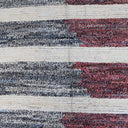 Textile showcasing a rustic striped pattern with varied textures.
