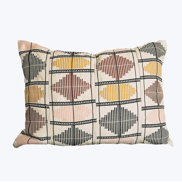 Geometric patterned throw pillow adds modern flair to any space.