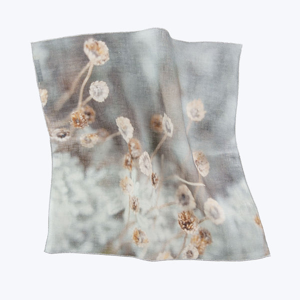 Delicate floral fabric with soft tones, creating a vintage impression.
