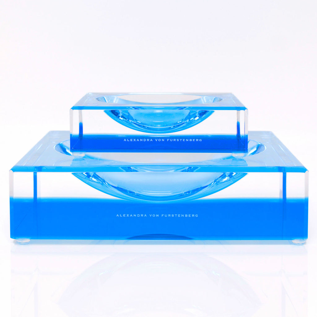 Two sleek, transparent acrylic blocks in vibrant blue - modern elegance.