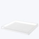 Minimalistic acrylic tray with raised edges for stylish organization.