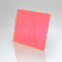 Transparent pink acrylic tabletop display stand with sleek, modern design.