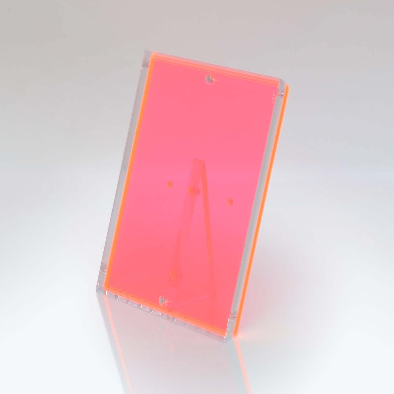 Transparent pink stand with 'A' shape design for displaying items