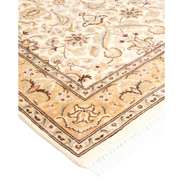 Ornate Persian-inspired area rug with elaborate scrollwork and floral motifs.