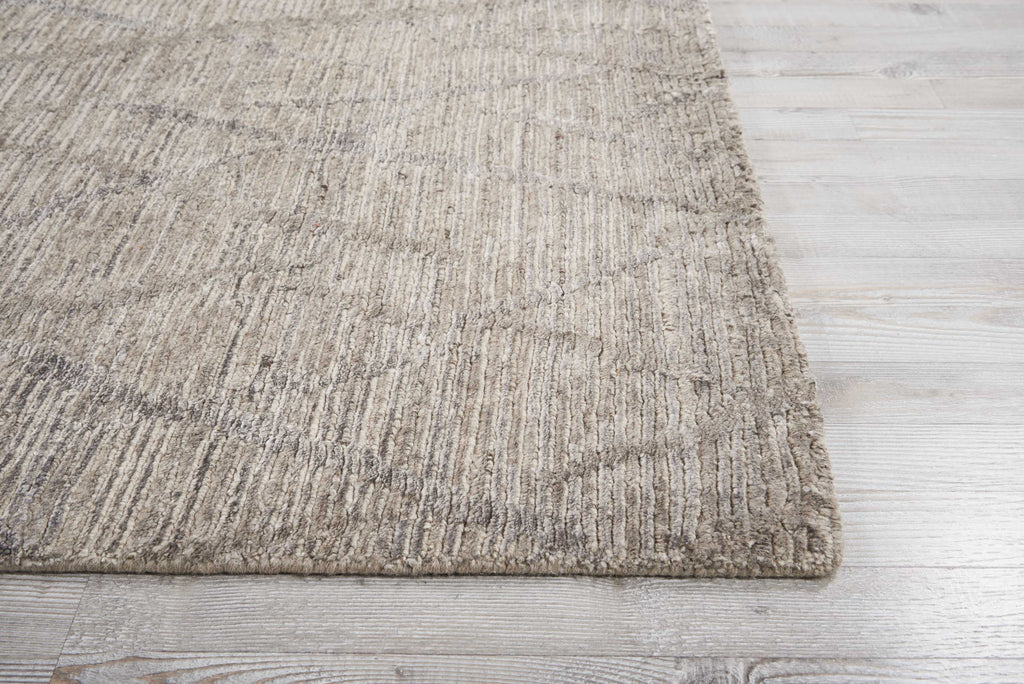 Cozy shaggy rug on light wooden floor adds warmth and texture.