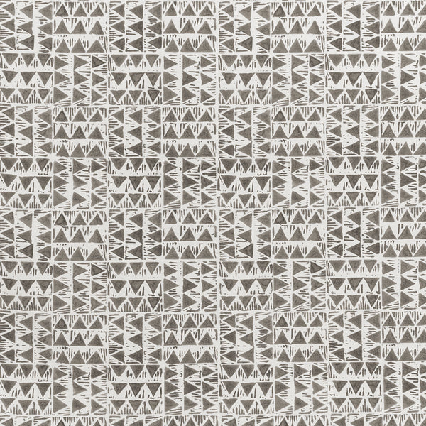 Seamless tribal-inspired pattern with geometric shapes in monochrome colors.