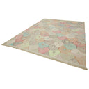 Rectangular rug with pastel hexagon pattern and soft fringe.