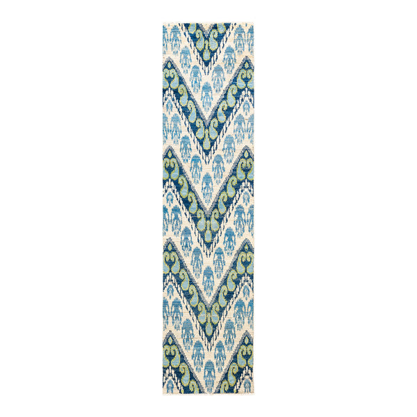 Intricate blue, cream, and taupe textile with ornate, symmetrical pattern.