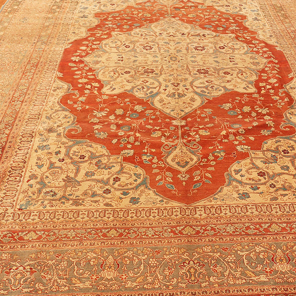 Ornately patterned Persian carpet with warm red-orange background and intricate designs