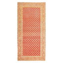 Intricately designed rectangular area rug featuring rich red color and floral motifs.