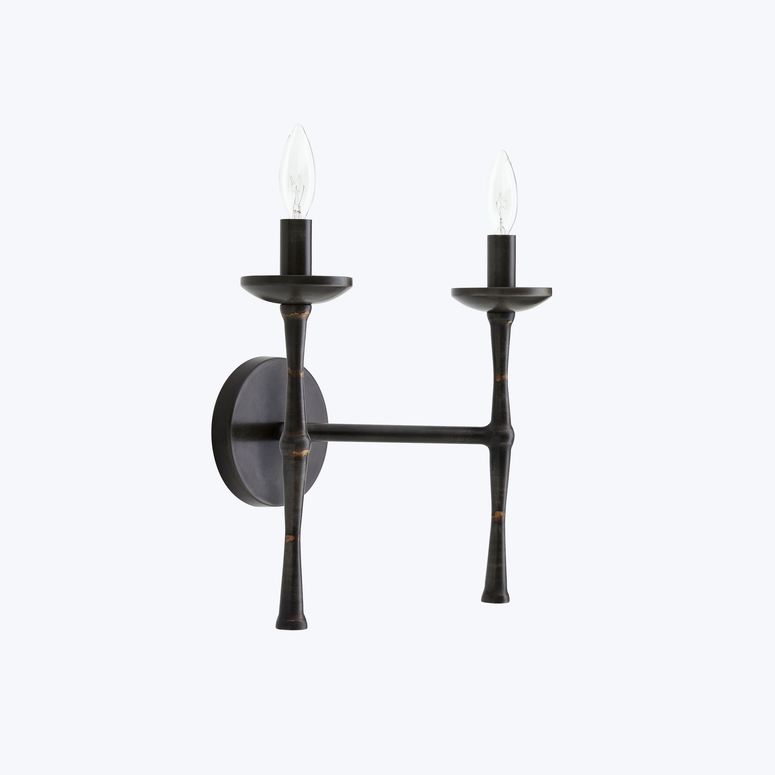 Vintage-inspired electric sconce adds a decorative touch to any space.