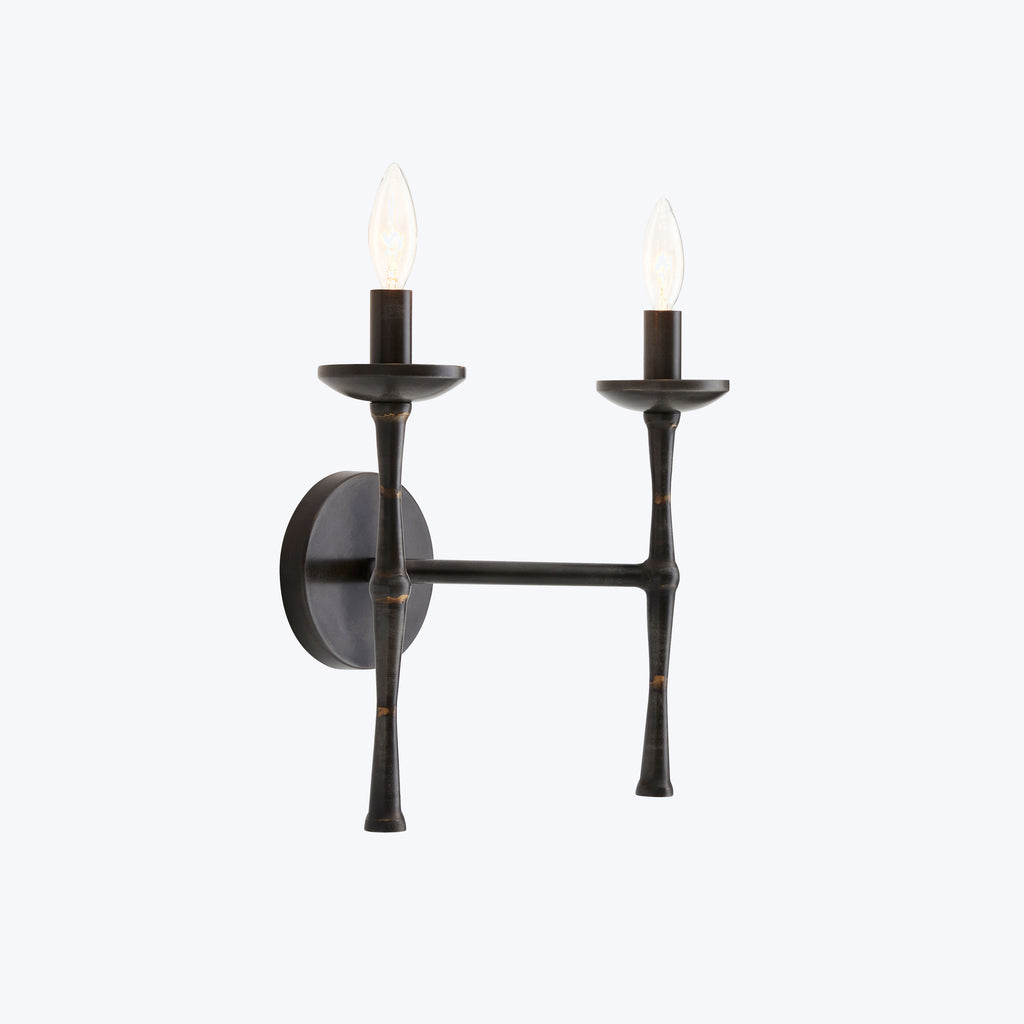 Elegant wall-mounted candlestick light fixture adds a classic touch.