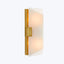 Sleek, contemporary wall-mounted light fixture with warm frosted glow.