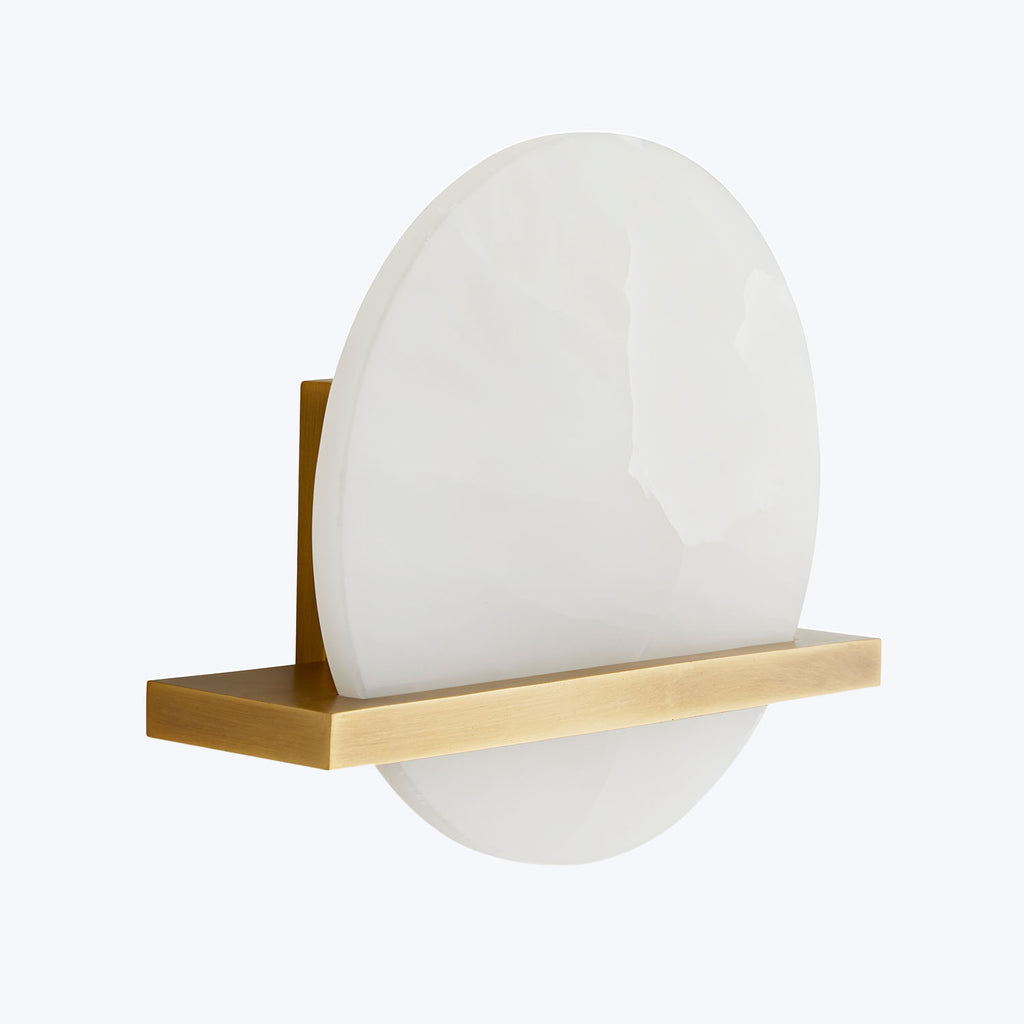 Stylish circular shelf with golden bracket adds modern elegance.