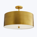 Contemporary golden ceiling light fixture with sleek cylindrical design.