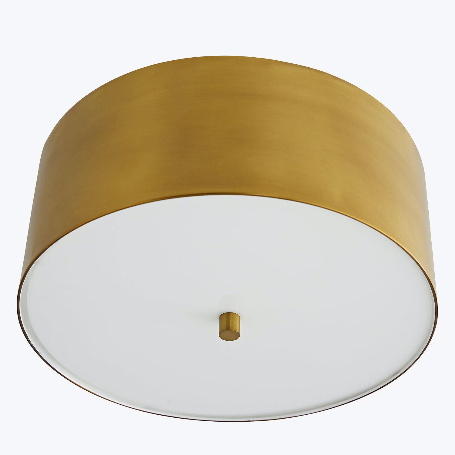 Sleek cylindrical flush mount light fixture with gold exterior finish.