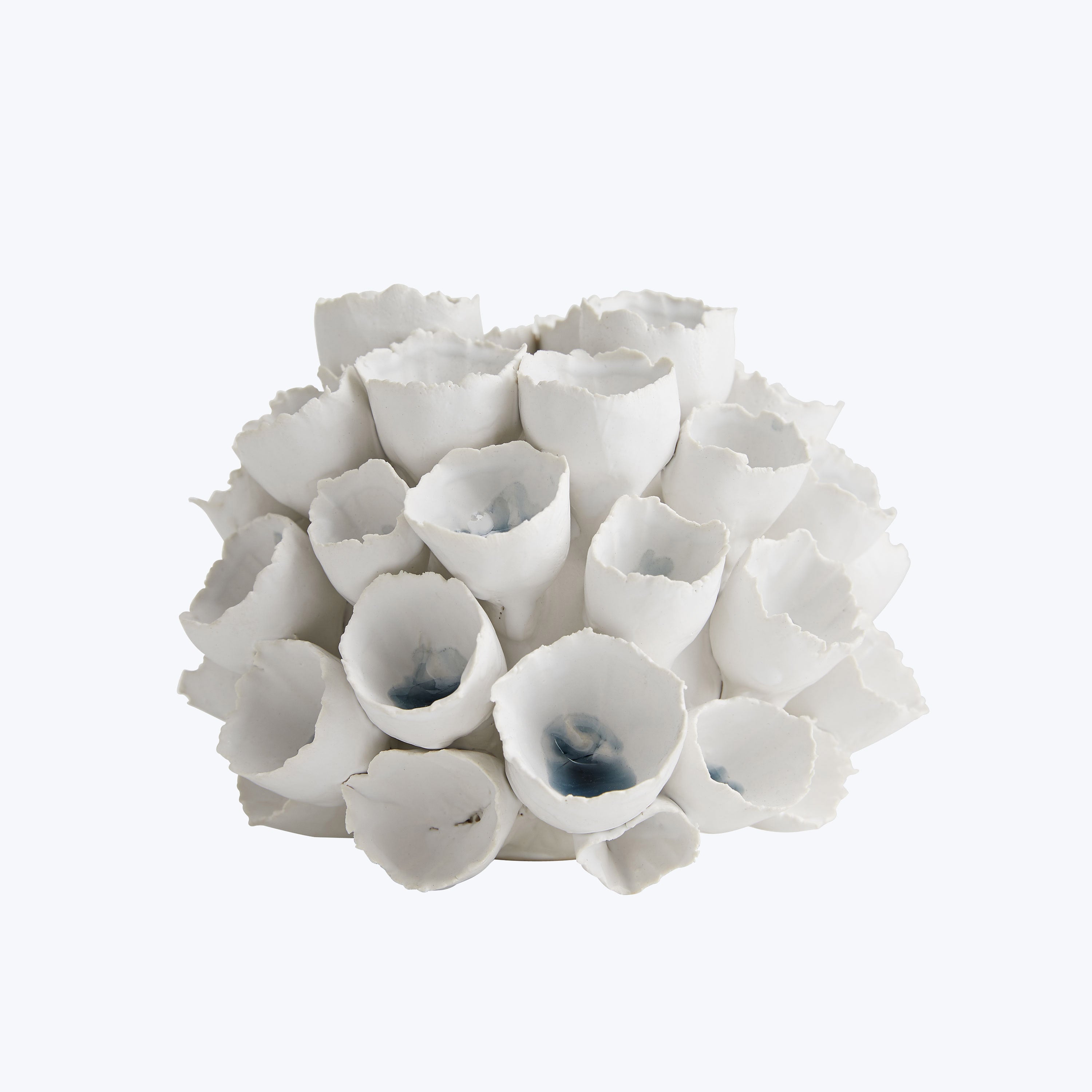 Delicate white flower-like ceramic objects, a serene and elegant decor.