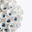 Handcrafted ceramic flowers with white petals and blue centers in varying shades