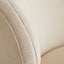 Close-up of textured beige fabric with prominent weave pattern and seam detail.