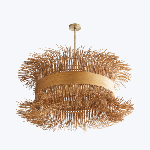Elaborate golden chandelier with straw-like elements creates a textured look.