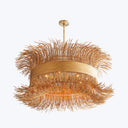 Unique and modern chandelier with golden bristle-like strands cascading downward.