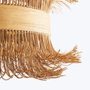 Handcrafted rattan object showcases intricate pattern and expert weaving technique.
