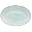 Oval ceramic plate with speckled design in light blue/aqua color.