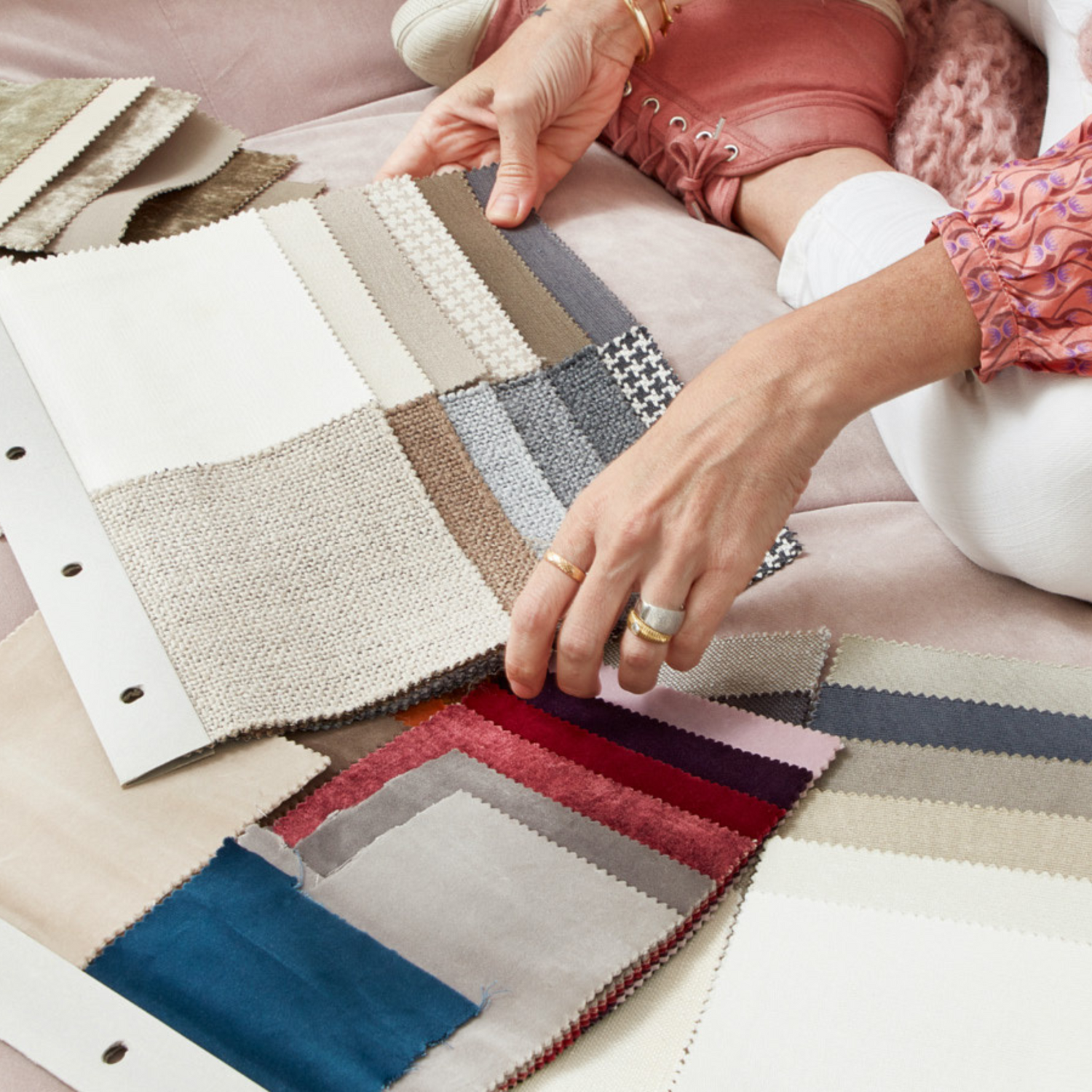 person choosing fabric swatches