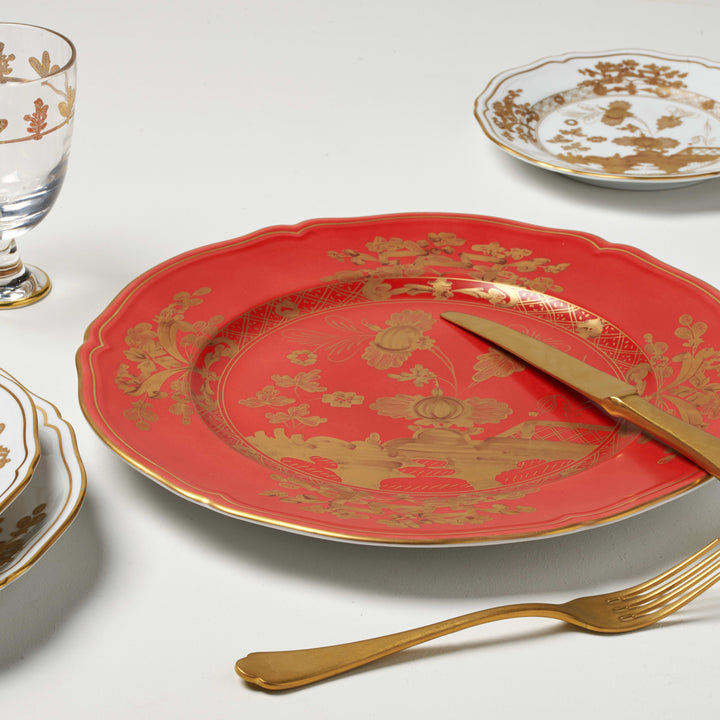 Exquisite red and gold dining ware set with elegant cutlery