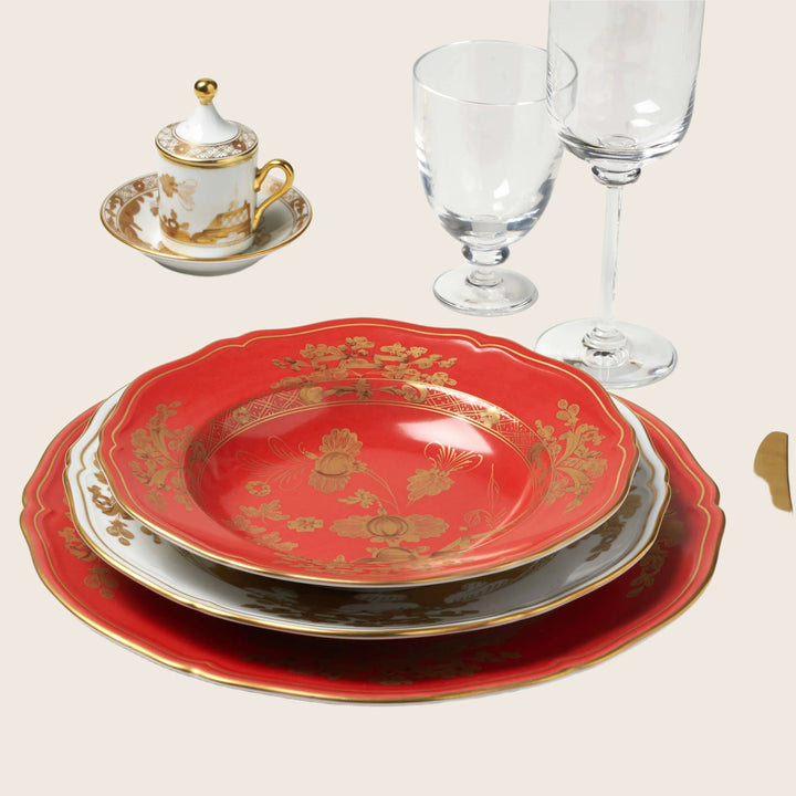 Elegant table setting with intricate golden dinnerware for formal dining.