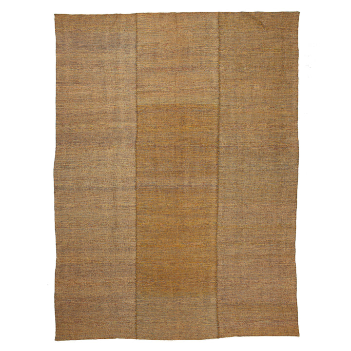 Organic, rustic woven fabric in natural earthy tones and texture.