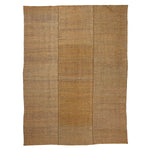 Organic, rustic woven fabric in natural earthy tones and texture.