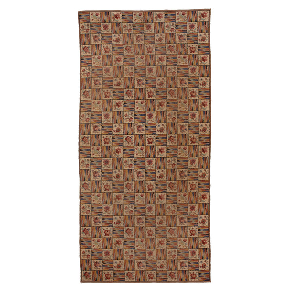 Traditional floral patterned rug in beige, brown, and red tones.