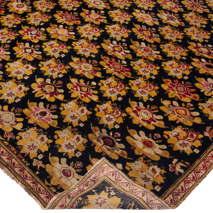 Intricately designed Persian-style rug with floral and geometric patterns.