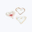 Handcrafted ceramic heart-shaped objects with translucent and rustic appearance.