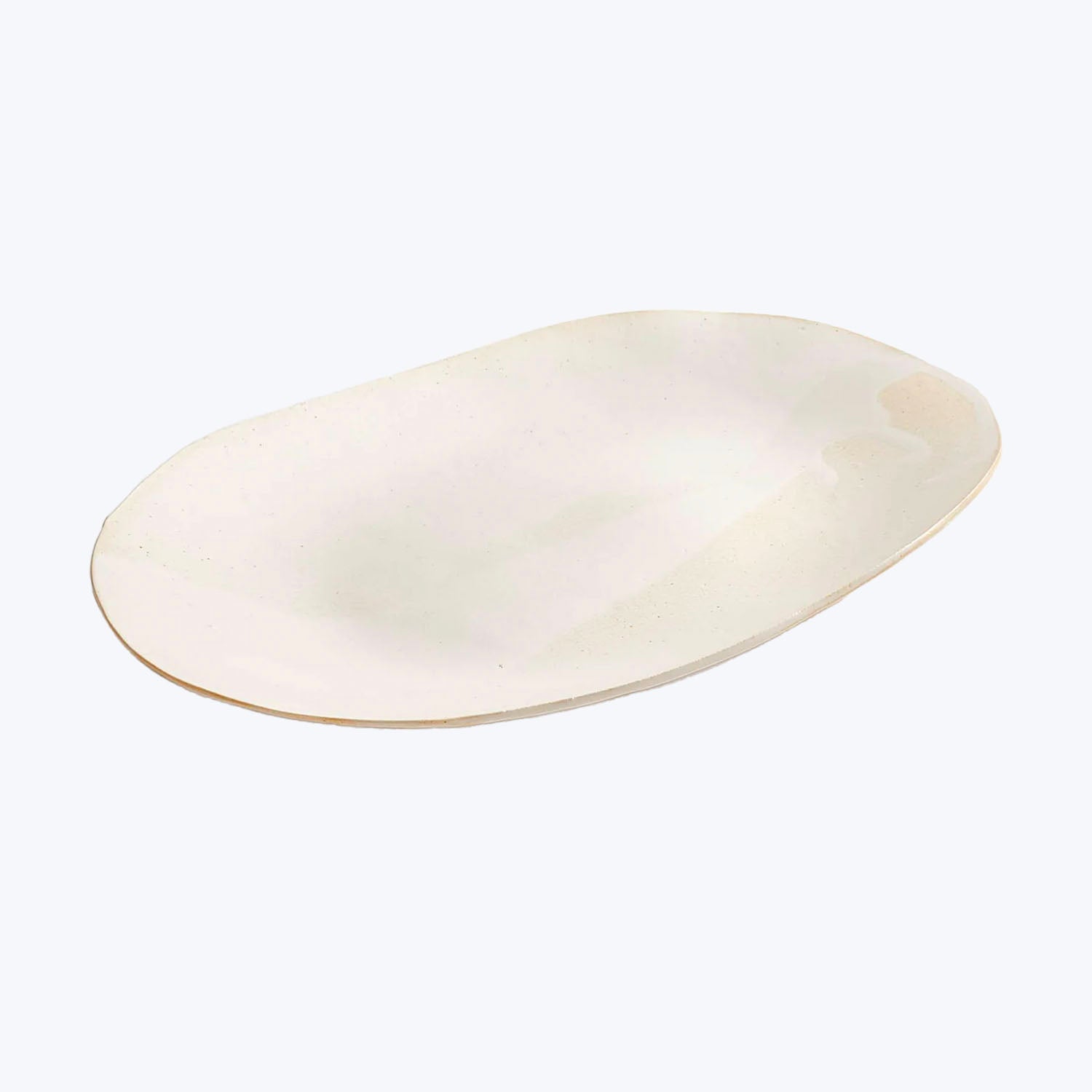 Empty oval plate with speckled surface on white background