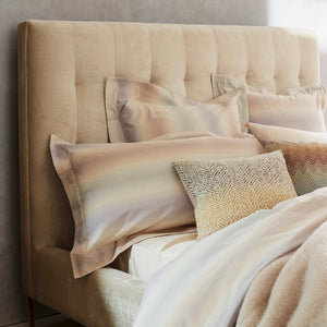 Contemporary bed with upholstered headboard and elegant metal legs. - hover