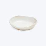 Handmade white ceramic dish with organic shape and raised edge