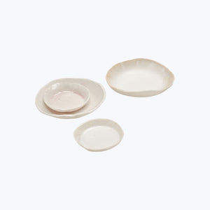 Handmade white ceramic dish with organic shape and raised edge - hover