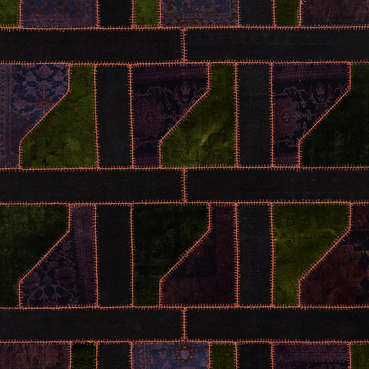 Abstract patchwork quilt pattern in shades of purple, black, green.