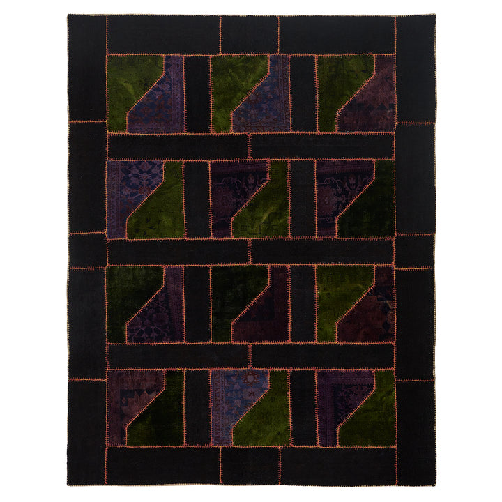 Intricate patchwork quilt with geometric design in green and blue.
