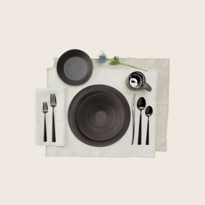 Plain black matte plate with shallow bowl shape and soft reflection. - hover