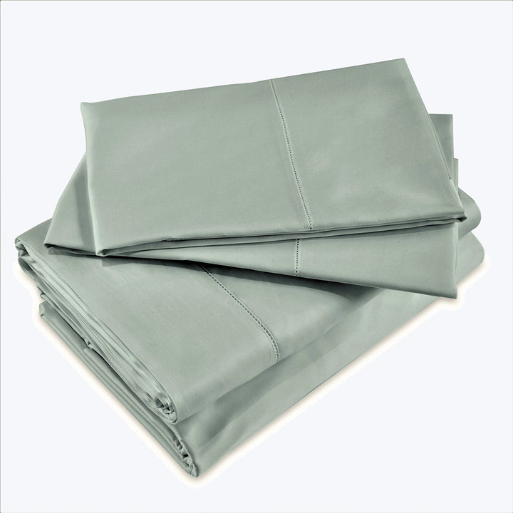 High-quality, luxurious bed sheets in smooth, muted color palette.