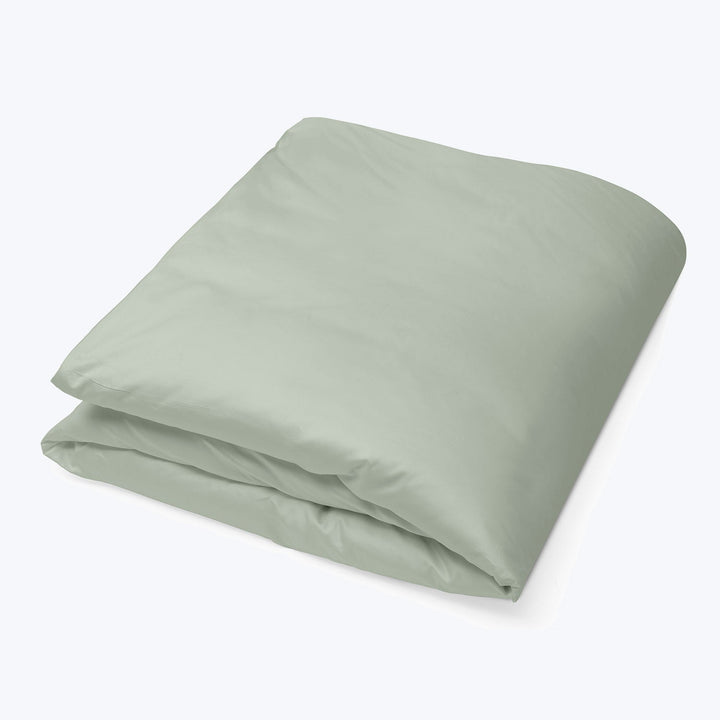 Folded light green fabric showcasing soft texture and quality material.
