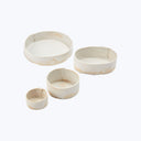 Set of four plain pottery bowls decreasing in size, aged look.