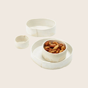 Minimalist white ceramic container with matte finish and irregularities. - hover