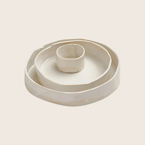 Versatile white ceramic dish, showing signs of use and wear. - hover
