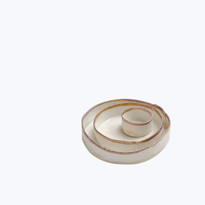 Transparent spiral object with concentric circular design on white background.