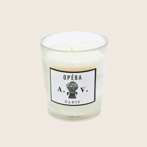 Elegant white candle in glass vessel with Parisian label design. - hover